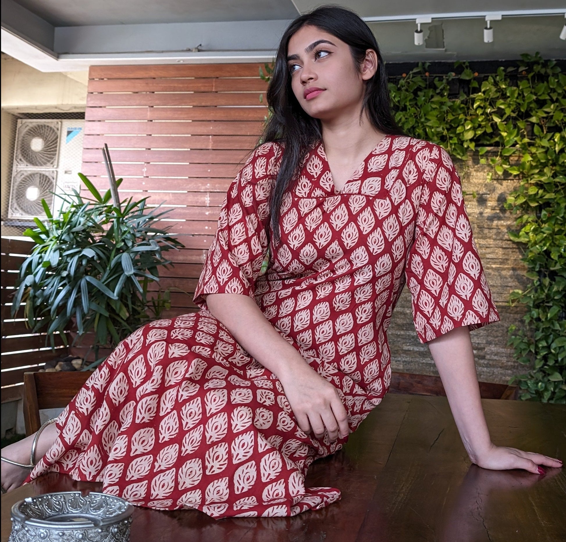 Girl Sitting on floor wearing ethnic indian Kurtha by Neelmii